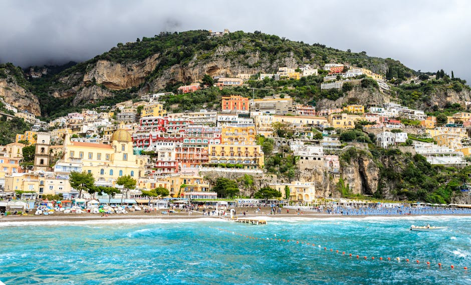 Vibrant seaside view of Positano's colorful hillside buildings overlooking the Mediterranean Sea